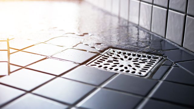 Water Flowing to Square Shower Drain